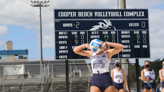Picture of Callie Workman setting the ball at the Cooper Beach Volleyball Courts.