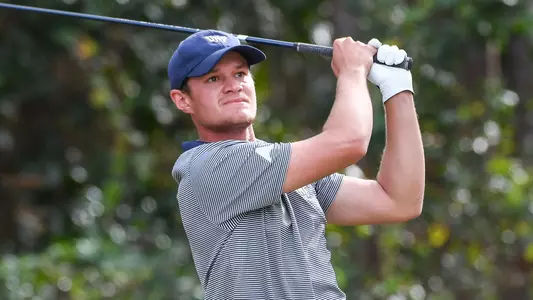 Nick Infanti watches his ball flight after swinging the golf club