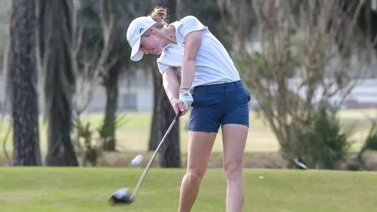 Christin Eisenbeiss swings her driver on the tee box