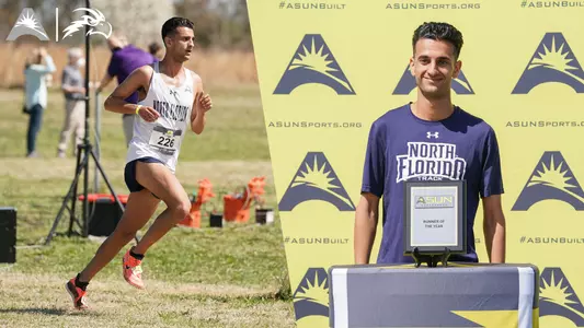 Nathan Jubran Running and posing with Runner of the Year Award featuring Osprey head and Asun logos in top left corner