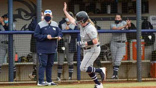 Rebecca Koskey comes around third after hitting a home run.