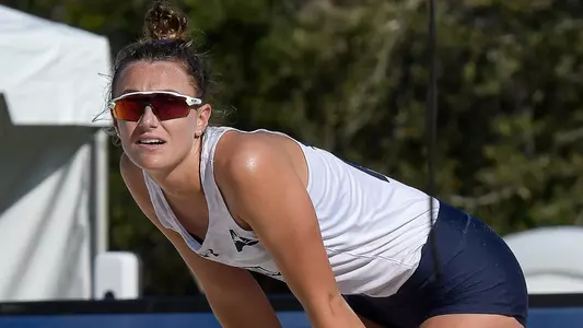 Antonia Harrison looks on.