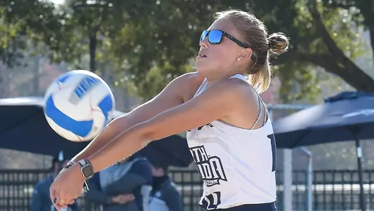 Anna Mallory digs out the ball.