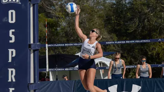 Callie Workman follows through on a serve.