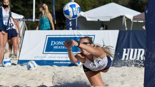 Callie Workman dives after a ball