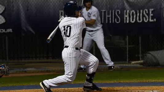 Austin Bogart swings at a pitch.
