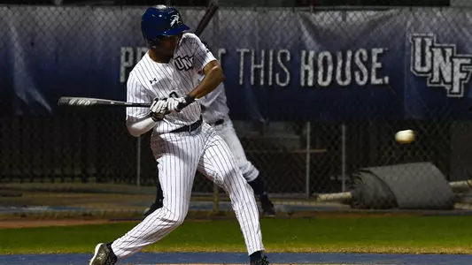 Justin Holmes swings at a pitch.