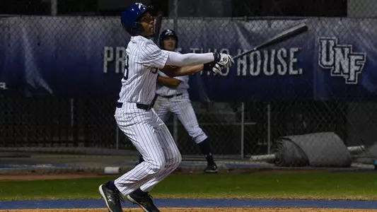 Justin Holmes swings at a pitch.