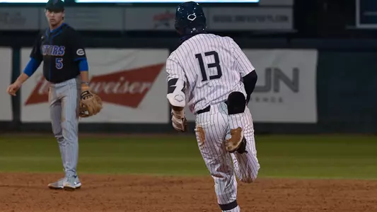 Abraham Sequera rounds second base.