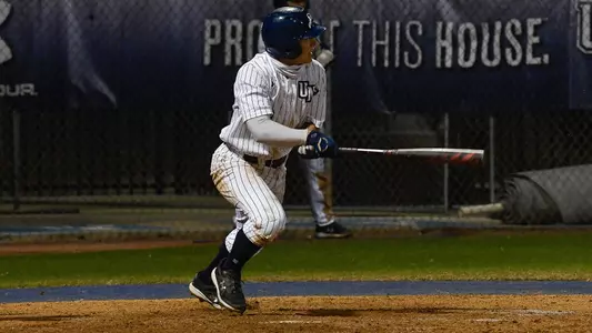Aidan Sweatt swings at a pitch.