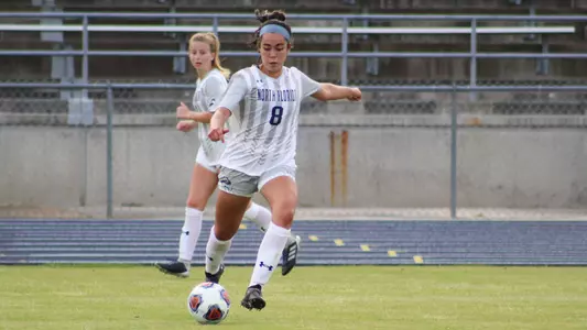 Ari Munoz kicks a soccer ball