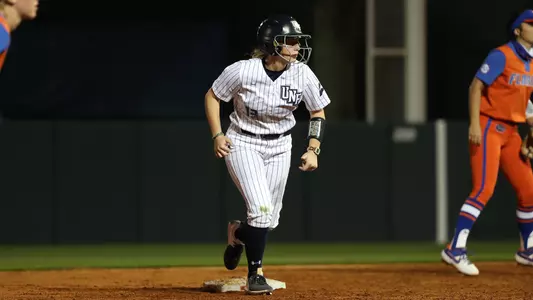 Regan Hermeling runs the baseball against Florida.