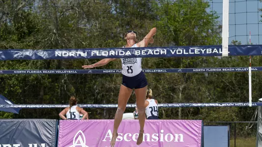 Chantel McMillian serves the ball.