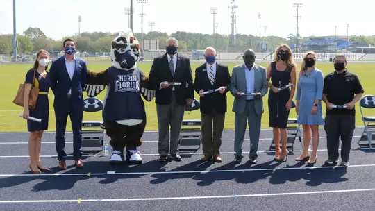 TDC Board poses as a group during press conference renaming Visit Jax Track facility