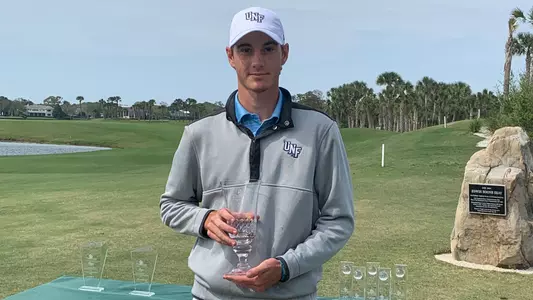 Nick Gabrelcik poses holding the championship trophy for the 2021 The Hayt