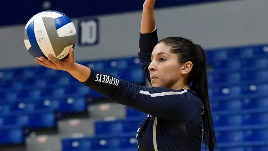 Rocio Moro preparing to serve