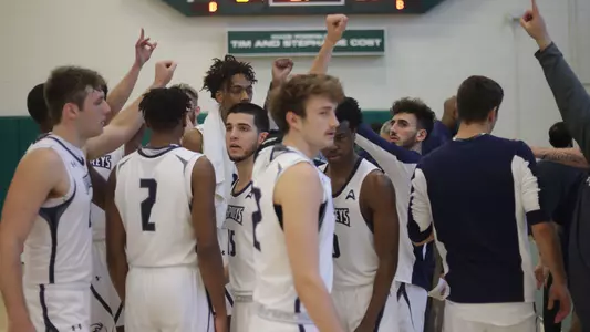 Men's basketball team huddle at ASUN Tournament