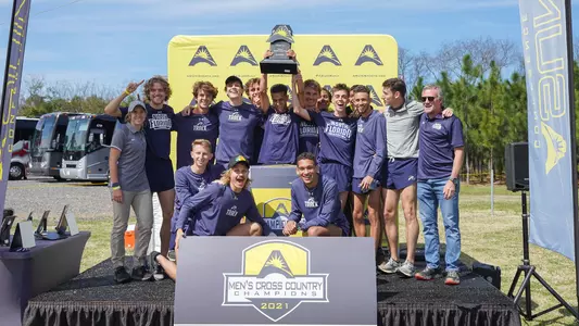 2021 ASUN Men's Cross Country Champions team picture with trophy