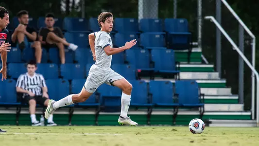 Robbie Soronellas sprints for the soccer ball in the ASUN quarterfinals.
