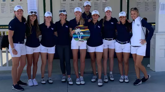 North Florida women's golf team poses with trophy for winning the 2021 UNF Collegiate