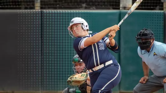Paige Pfent swings the softball bat at Jacksonville