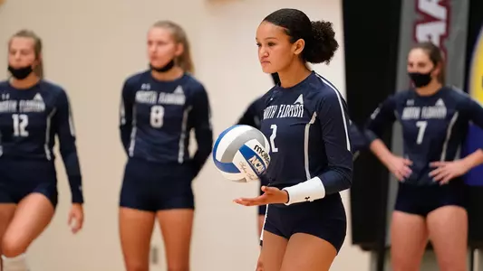 Kailey McKnight prepares to serve the ball.