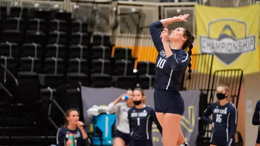 Grace Youngblood serves the ball.