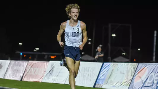 Noah Perkins running on track at UNF Invite