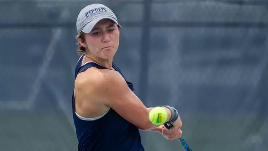 Catherine Gulihur hits a two-hand backhand.