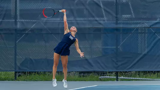 Annabelle Davis serves the ball.