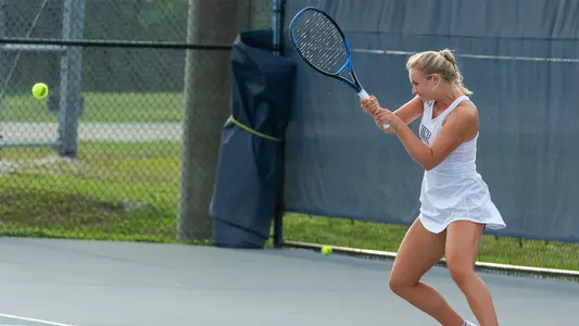 Summer Yardley hits a two-hand backhand.
