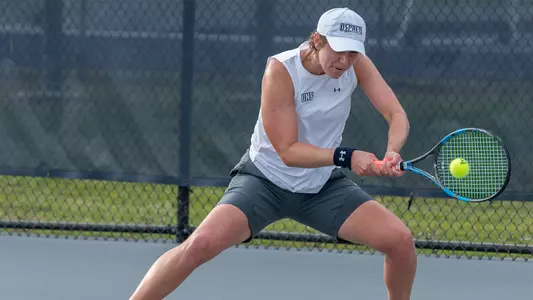 Catherine Gulihur hits a two-hand backhand.