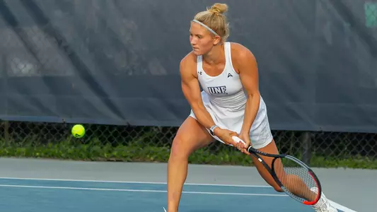 Annabelle Davis hits a two-hand backhand.