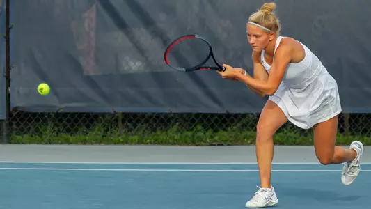 Annabelle Davis hits a two-hand backhand.