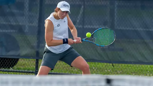 Catherine Gulihur hits a two-hand backhand.