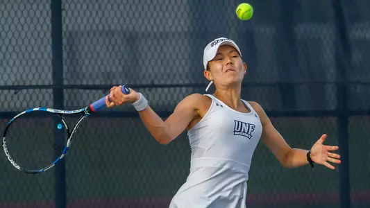 Constanza Gorches hits a high forehand.