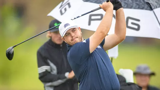 Michael Mattiace follows through on his golf swing at the NCAA Regional