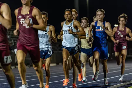 tim doyle running in UNF Invite on track