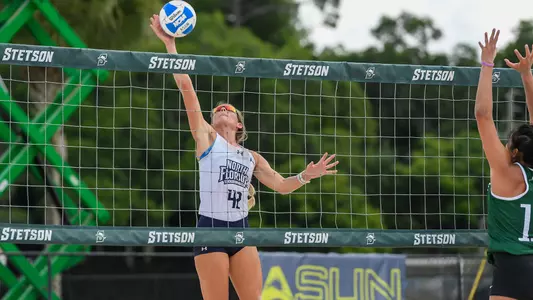 Taryn Griffey jumps long for the ball.
