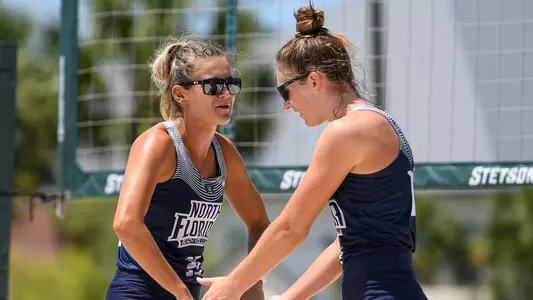 Chantel McMillan and Carolyn Cain high five