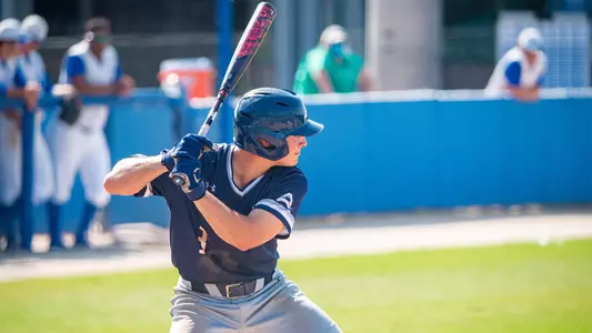 Aidan Sweatt waits a bat for the ball.