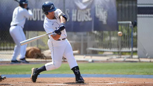 Austin Bogart swings at a pitch.