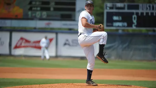 Tony Roca begins to throw a pitch.