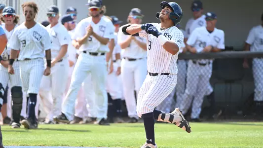 Abraham Sequera comes home after hitting a home run.