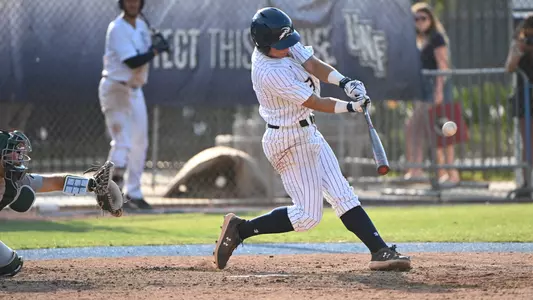 Aidan Sweatt swings at a pitch.