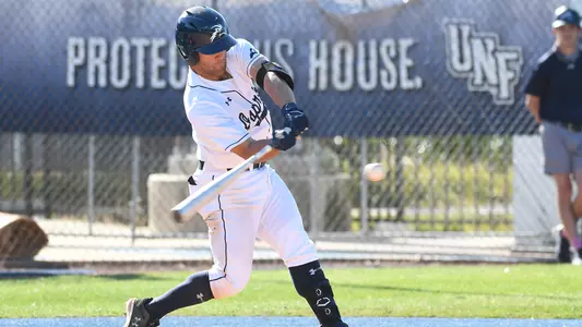 Austin Bogart makes contact with a pitch.