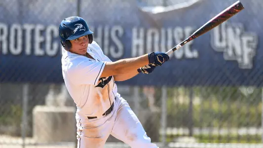 Aidan Sweatt swinging at a pitch.