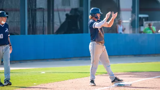 Cade Westbrook clapping at third base