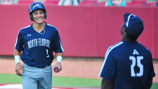 Aidan Sweatt smiling at Trey Spratling-Williams