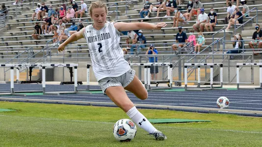 Haynes Grant serves the soccer ball from the corner